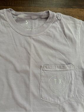 Frankie Jean Lavender Pocket Tee with TX Smile Graphic 100% cotton
